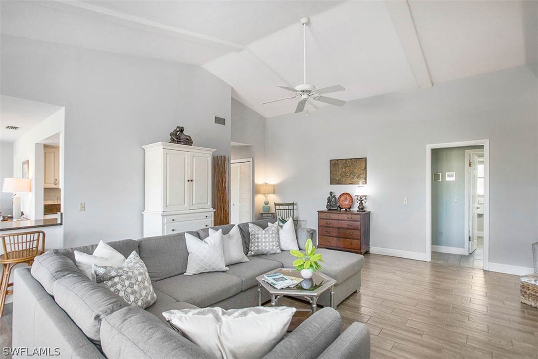 1447 Albatross Road Sanibel, FL 33957 - Photo 7 of 29 a living room with furniture and a wooden floor
