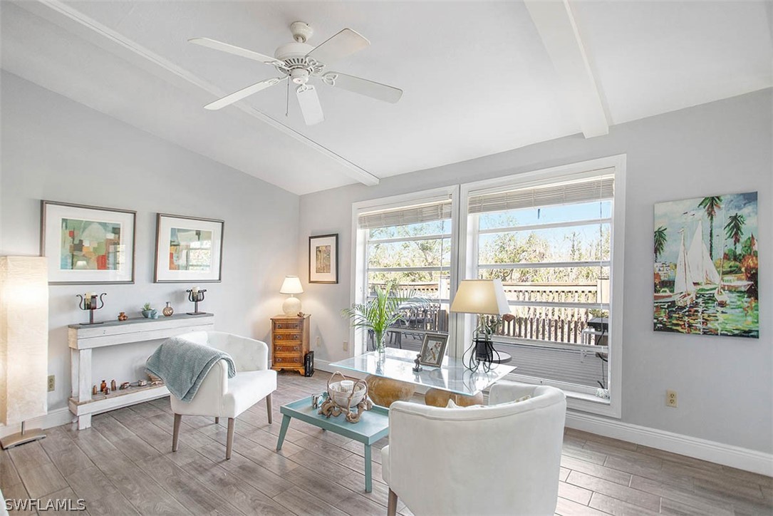 1447 Albatross Road Sanibel, FL 33957 - Photo 8 of 29 a living room with furniture and wooden floor