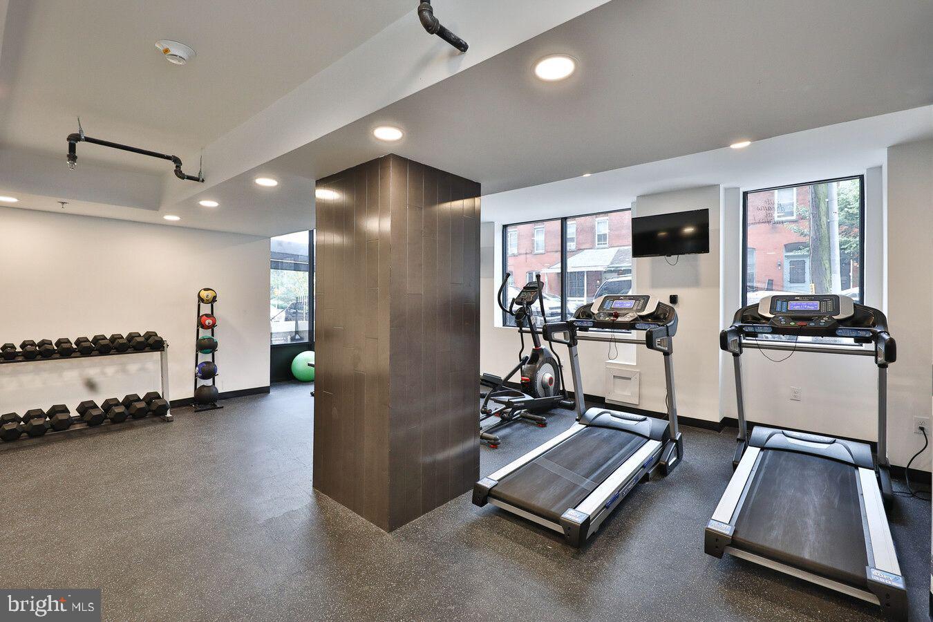 4247 Locust Street, Unit 1B805 Philadelphia, PA 19104 - Photo 23 of 38 a view of a room with gym equipment