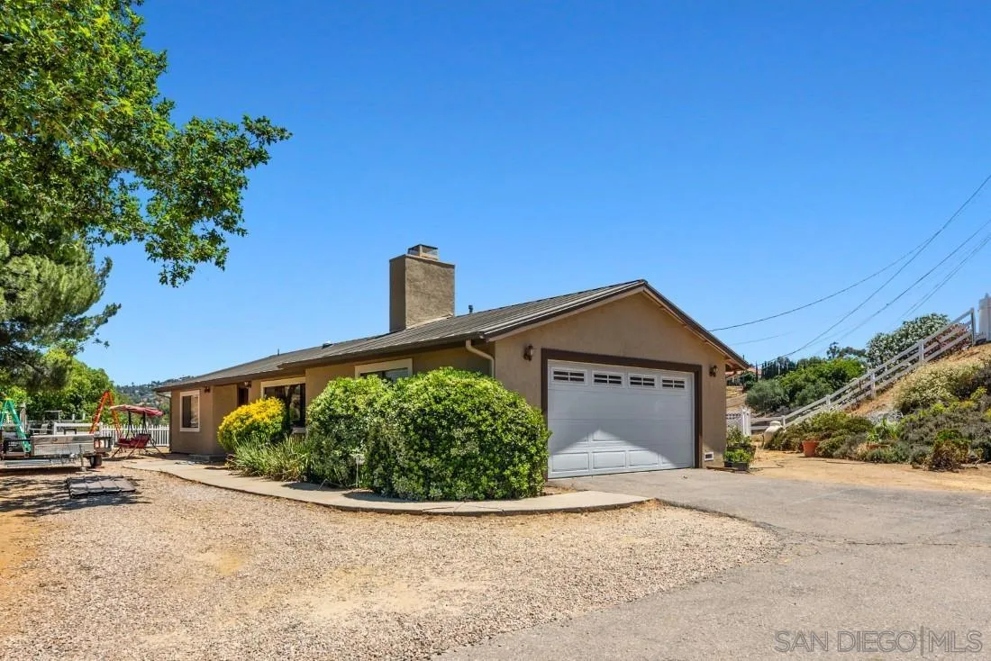 288 Peutz Valley Road Alpine, CA 91901 - Photo 1 of 68 a front view of a house with a yard and garage