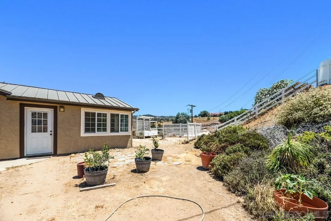 288 Peutz Valley Road Alpine, CA 91901 - Photo 40 of 68 a view of a house with swimming pool and sitting area