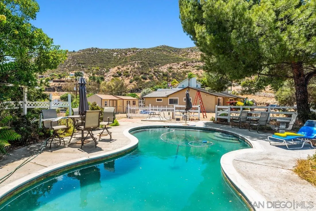 288 Peutz Valley Road Alpine, CA 91901 - Photo 8 of 68 a view of swimming pool with outdoor seating and a garden