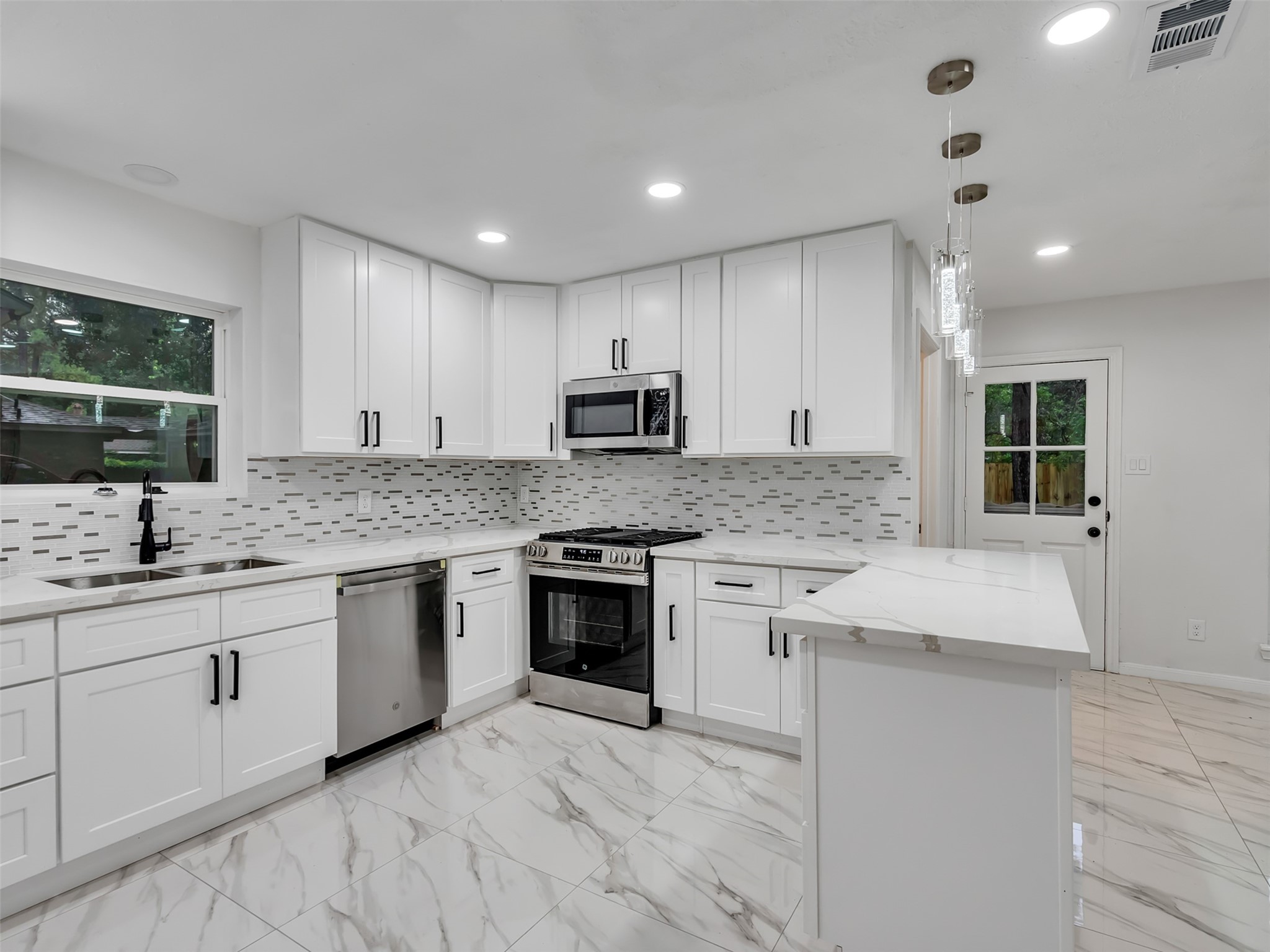4023 Laverock Road Spring, TX 77388 - Photo 8 of 36 Open kitchen with new stainless steel appliances