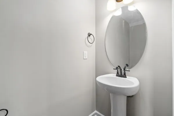 a bathroom with a sink and mirror