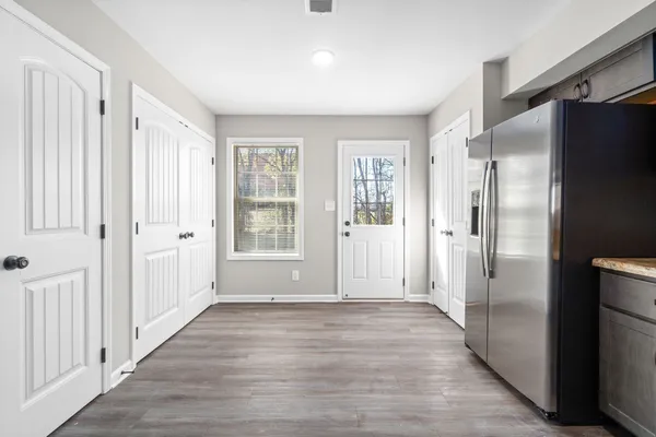wooden floor in an empty room with a window