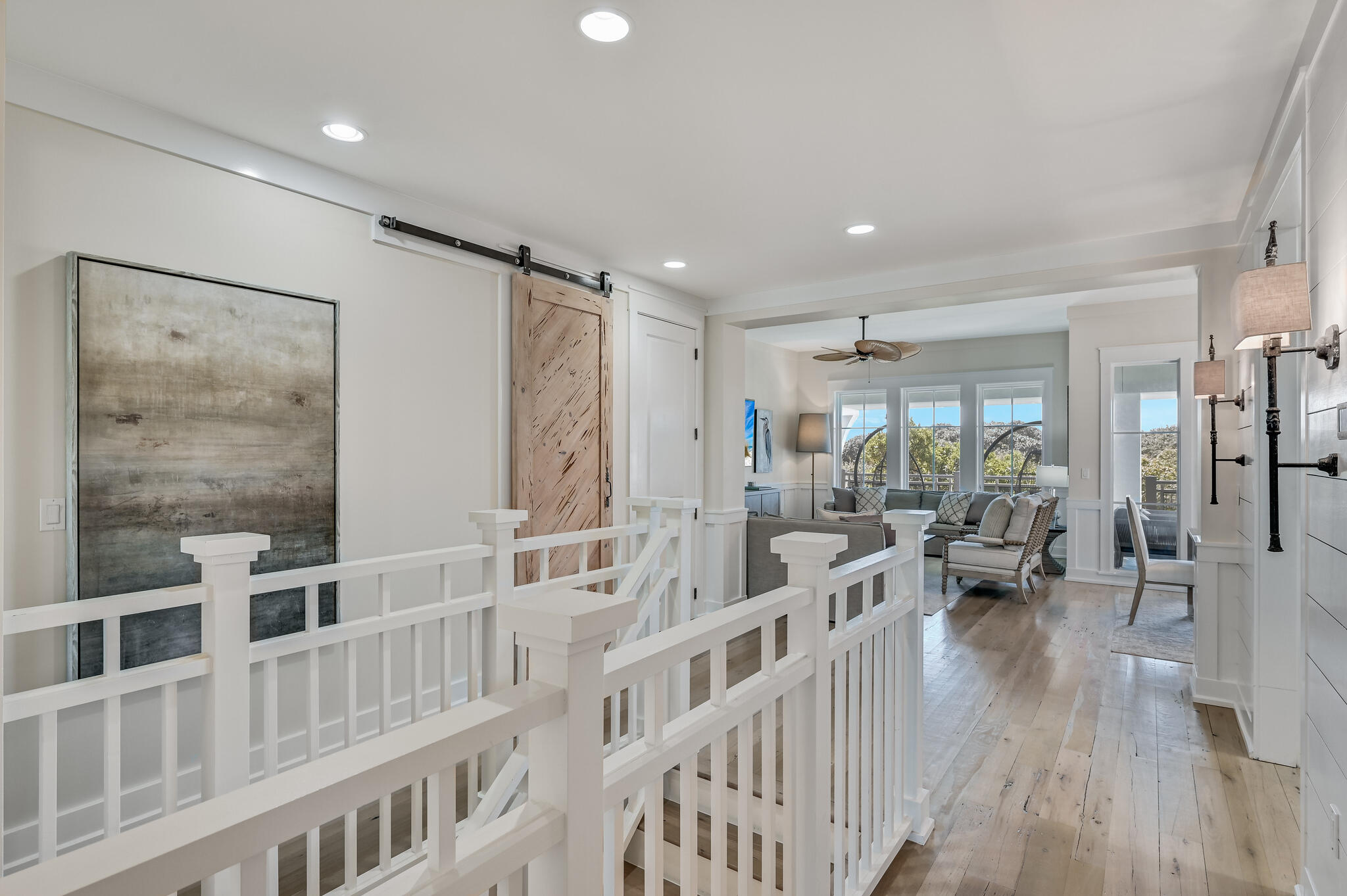 37 Compass Point Way South, Unit 108 Inlet Beach, FL 32461 - Photo 17 of 65 a living room with furniture wooden floor and a large window