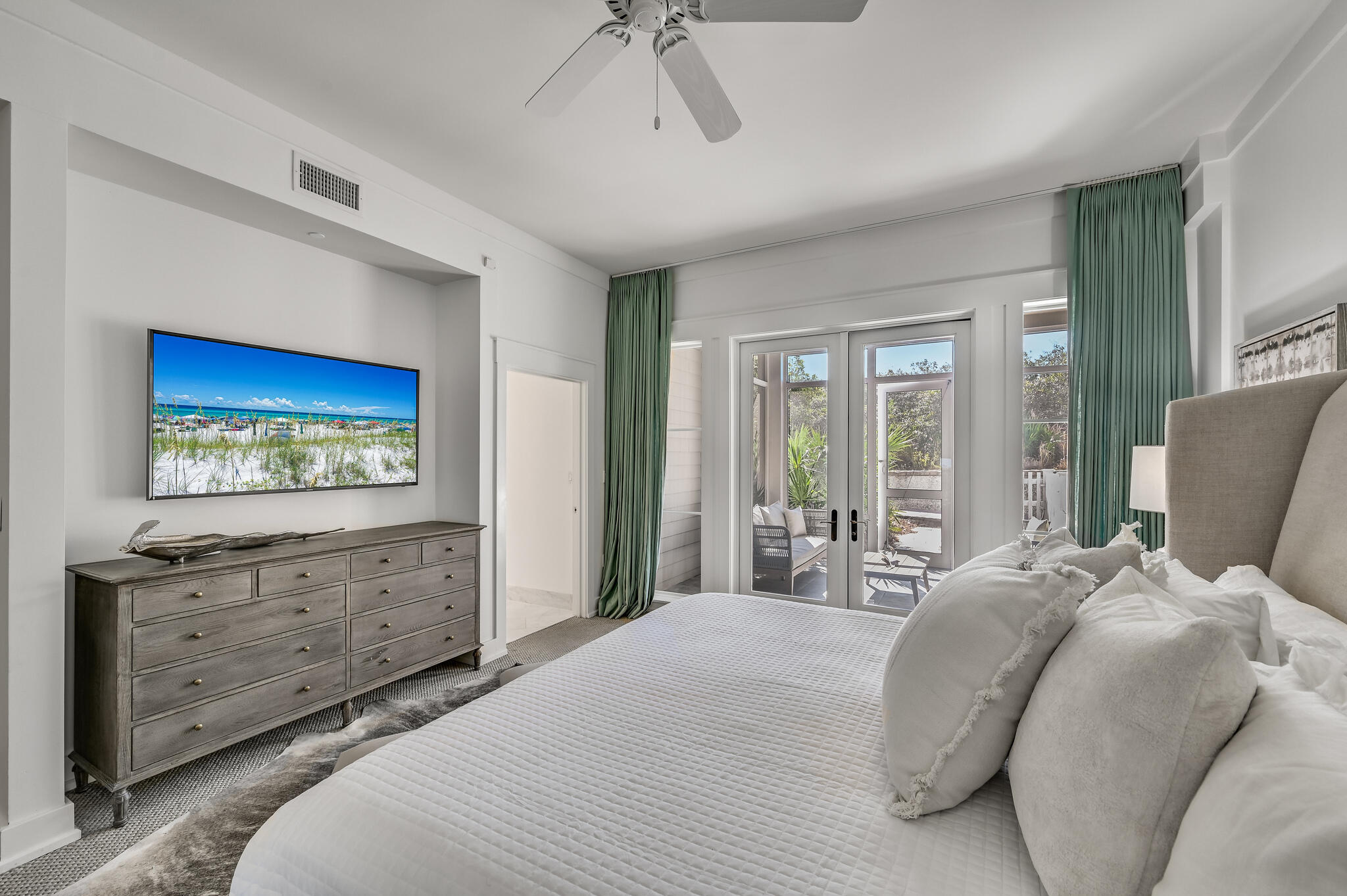 37 Compass Point Way South, Unit 108 Inlet Beach, FL 32461 - Photo 19 of 65 a bedroom with a bed and a flat screen tv