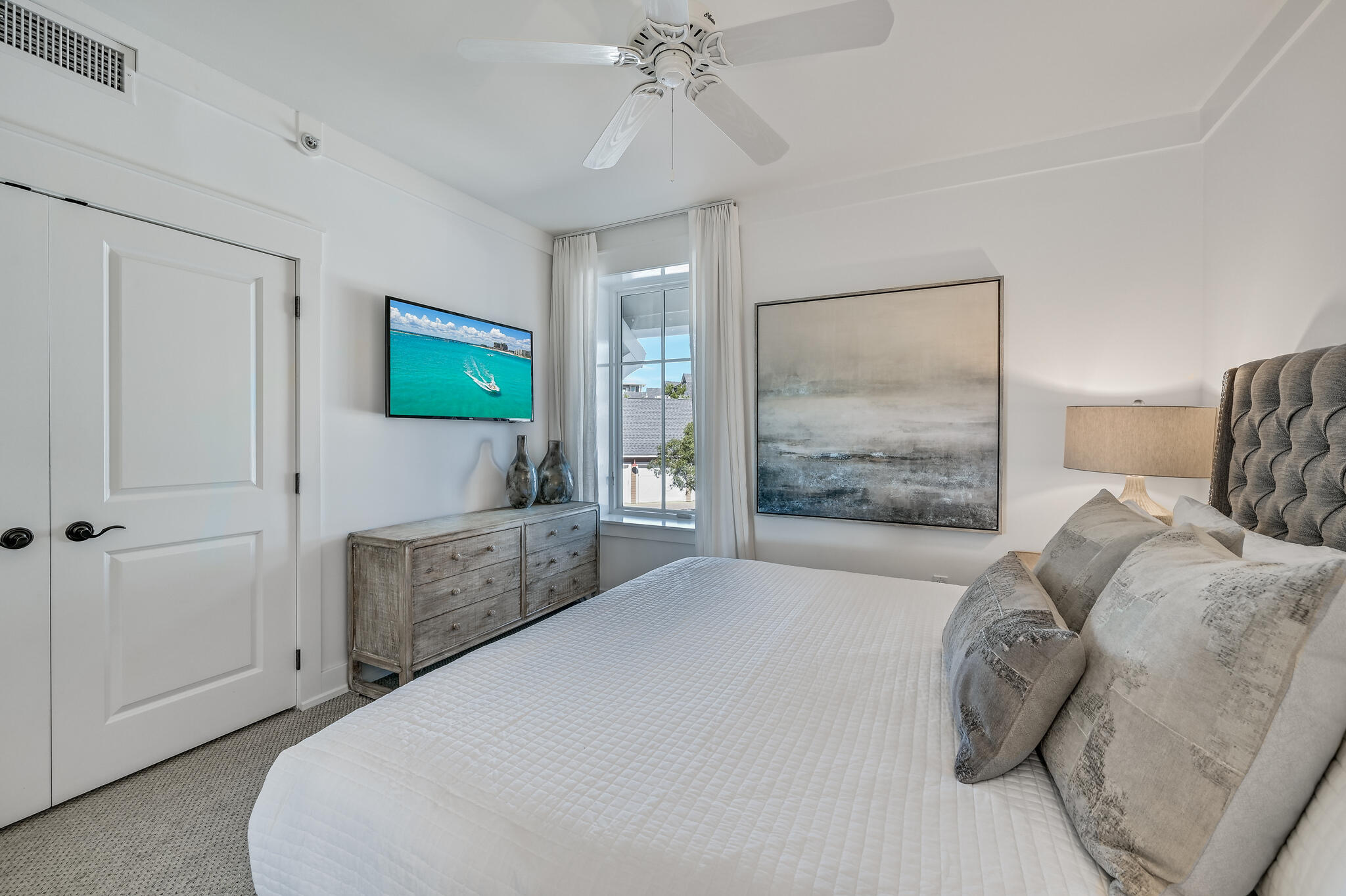 37 Compass Point Way South, Unit 108 Inlet Beach, FL 32461 - Photo 33 of 65 a bedroom with a bed and a chandelier