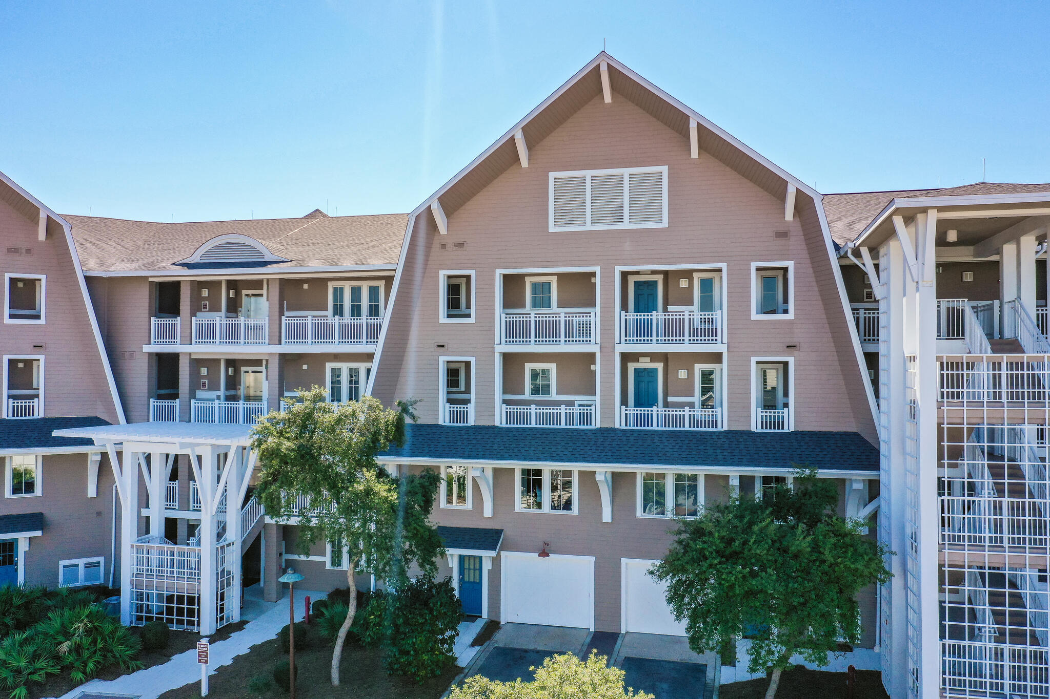 37 Compass Point Way South, Unit 108 Inlet Beach, FL 32461 - Photo 6 of 65 a front view of a residential apartment building with a yard