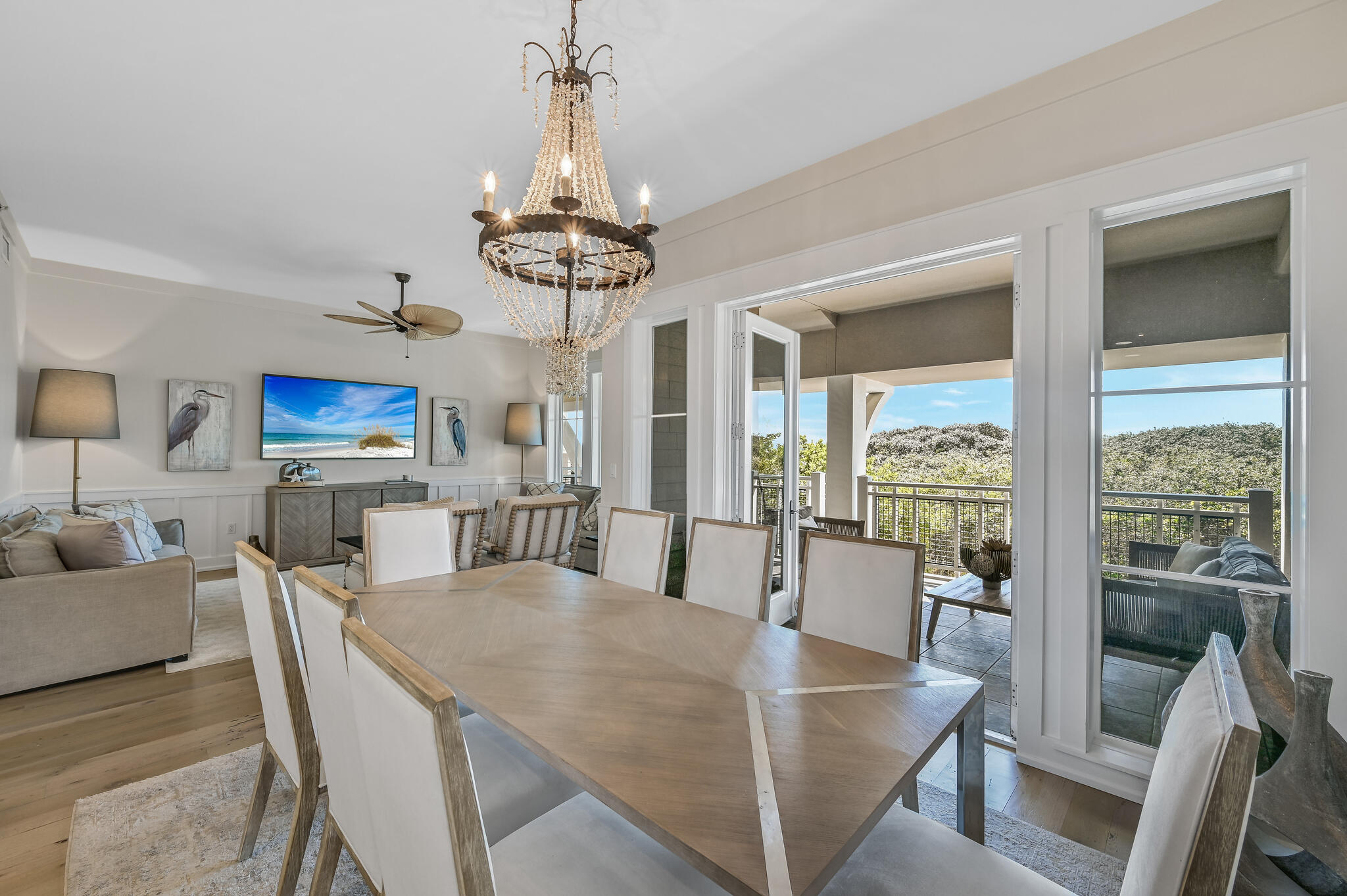 37 Compass Point Way South, Unit 108 Inlet Beach, FL 32461 - Photo 8 of 65 a view of a dining room with furniture wooden floor and chandelier