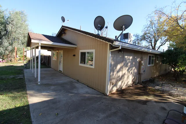 an aerial view of house with yard