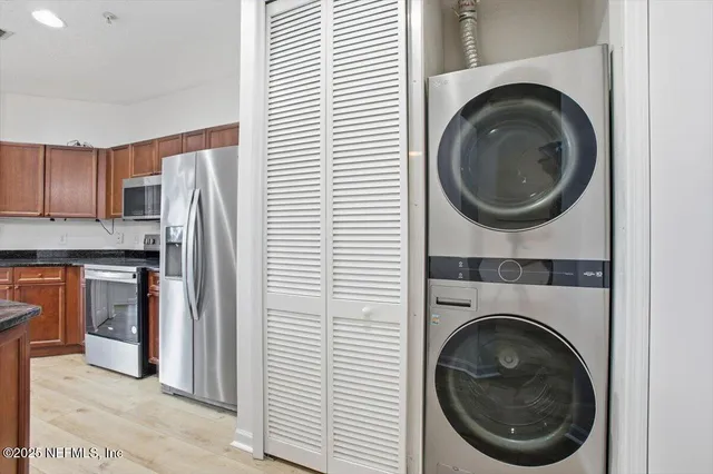 a view of a kitchen with washer and dryer