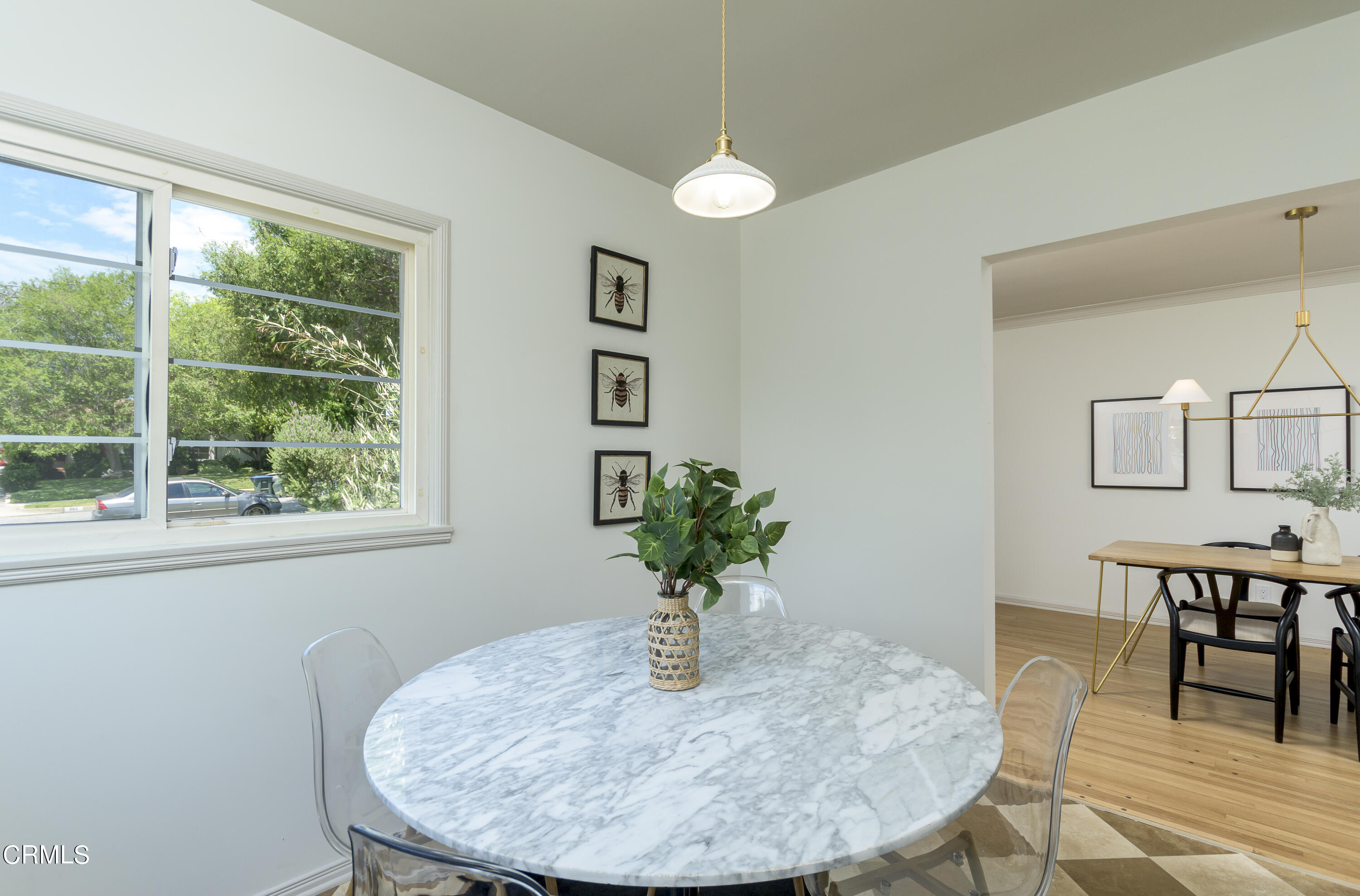 960 Roxbury Drive Pasadena, CA 91104 - Photo 11 of 28 a view of a dining room with furniture a potted plant and wooden floor