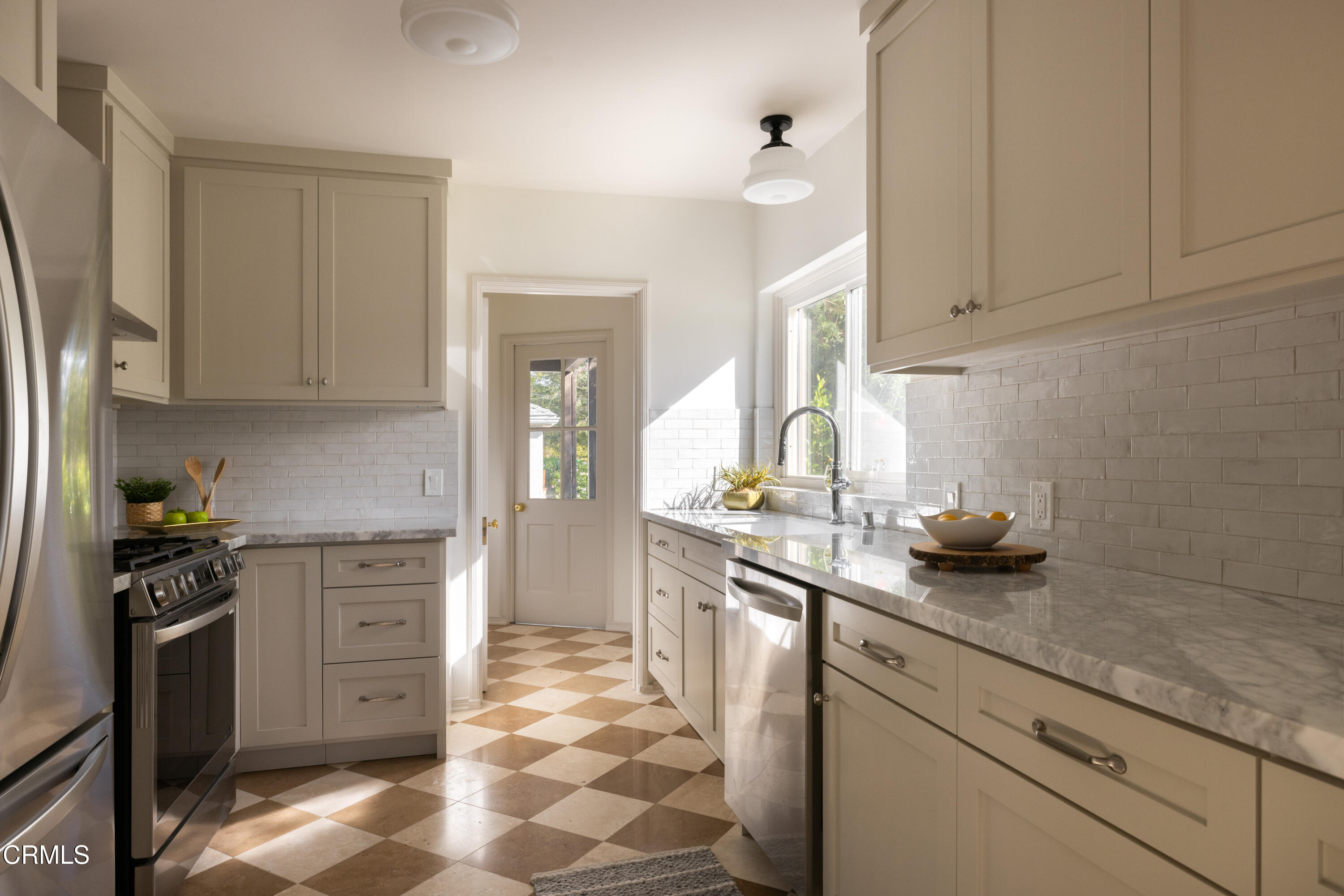 960 Roxbury Drive Pasadena, CA 91104 - Photo 18 of 28 a kitchen with stainless steel appliances granite countertop a sink stove and refrigerator