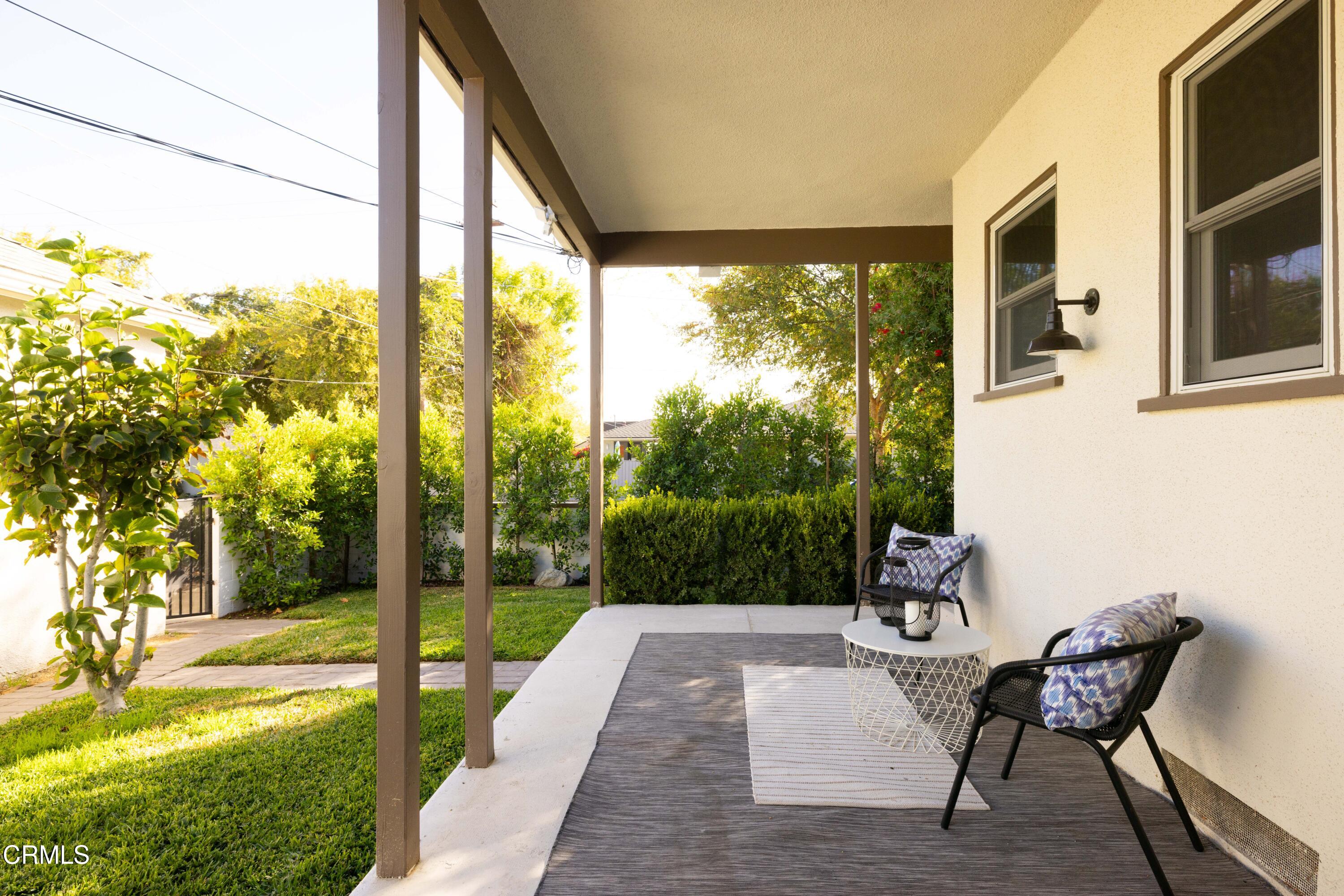 960 Roxbury Drive Pasadena, CA 91104 - Photo 26 of 28 a view of a porch with chairs and backyard