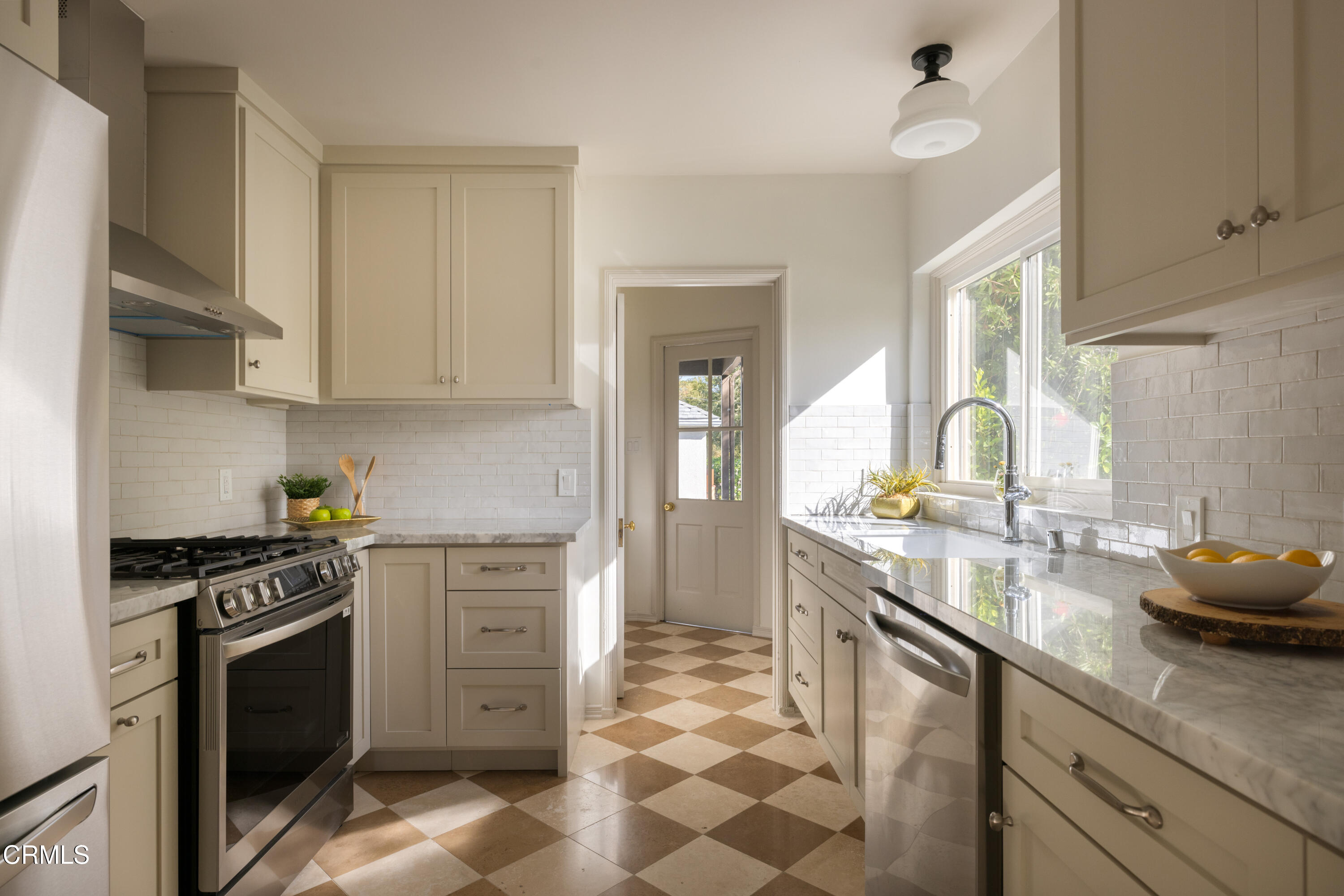 960 Roxbury Drive Pasadena, CA 91104 - Photo 8 of 28 a kitchen with a stove a sink and a refrigerator