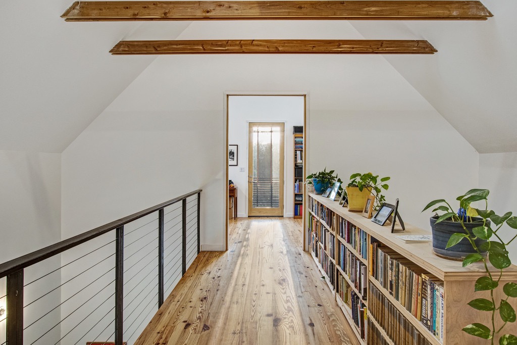 534 Old McDade Road Elgin, TX 78621 - Photo 25 of 40 Cat walk leads to two upstairs bedrooms. Ceiling beams continue on the vaulted ceilings, adding style and warmth.