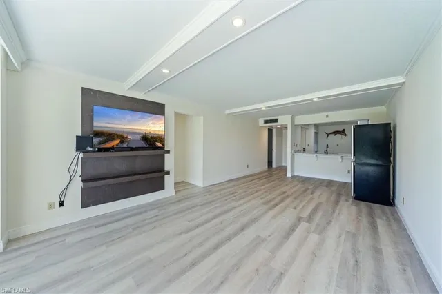 a view of a livingroom with wooden floor