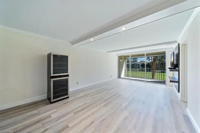 wooden floor in an empty room with window