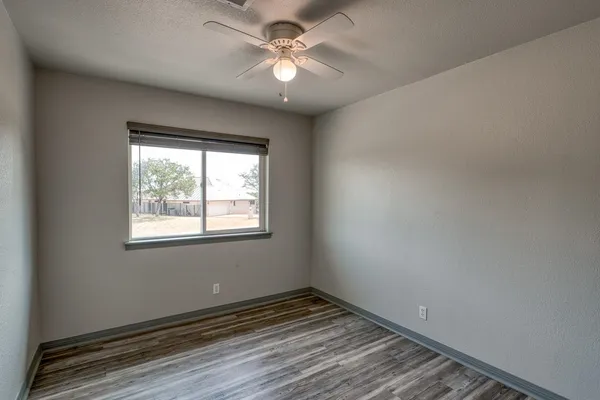 a bathroom with a sink toilet a mirror and shower