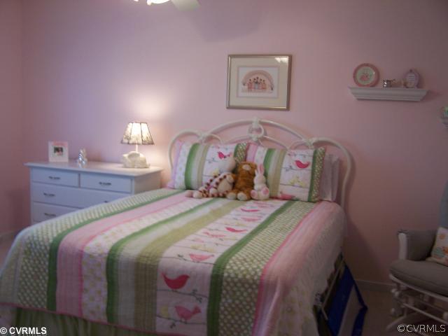 1001 Goswick Ridge Road Midlothian, VA 23114 - Photo 8 of 10 a bedroom with a bed and a lamp on dresser