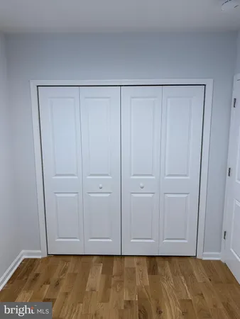 a view of room with hardwood floor