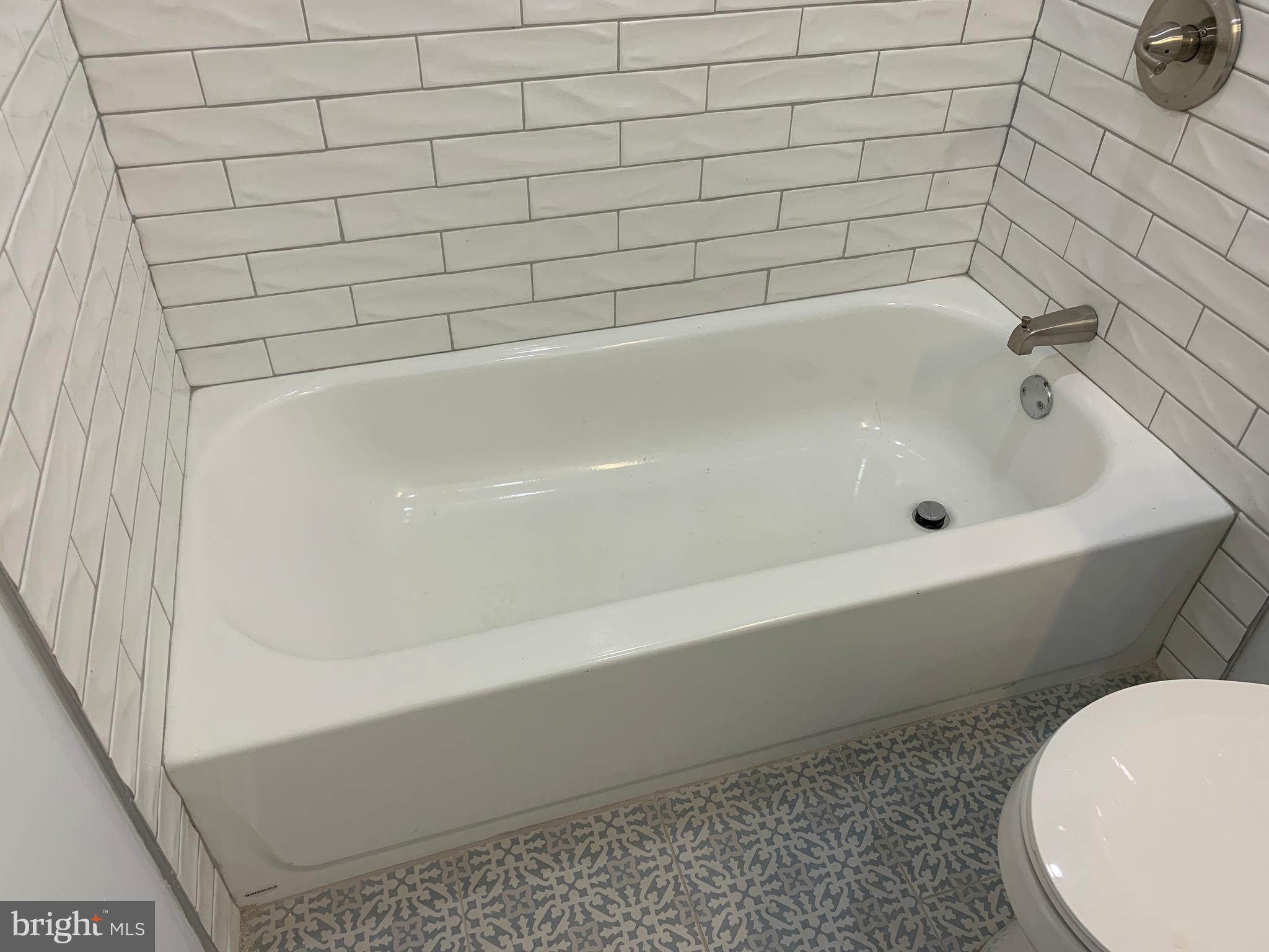 431 South 56th Street, Unit 1 Philadelphia, PA 19143 - Photo 20 of 29 a bathroom with a bathtub
