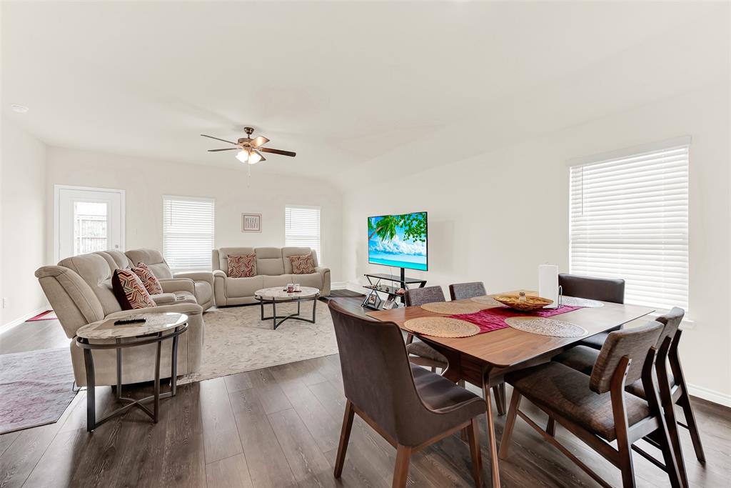 720 Willow View Way Princeton, TX 75407 - Photo 12 of 33 a view of a dining room with furniture and wooden floor