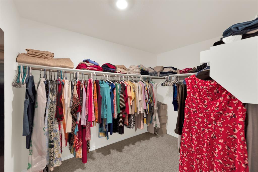 720 Willow View Way Princeton, TX 75407 - Photo 17 of 33 a view of walk in closet with clothes