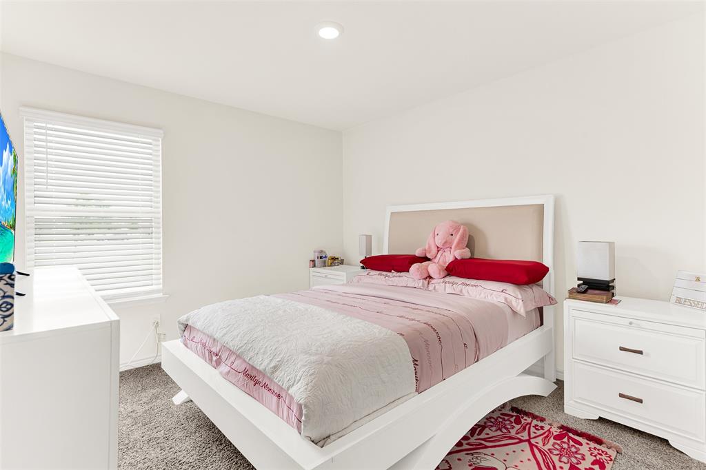 720 Willow View Way Princeton, TX 75407 - Photo 18 of 33 a bedroom with a bed and a window
