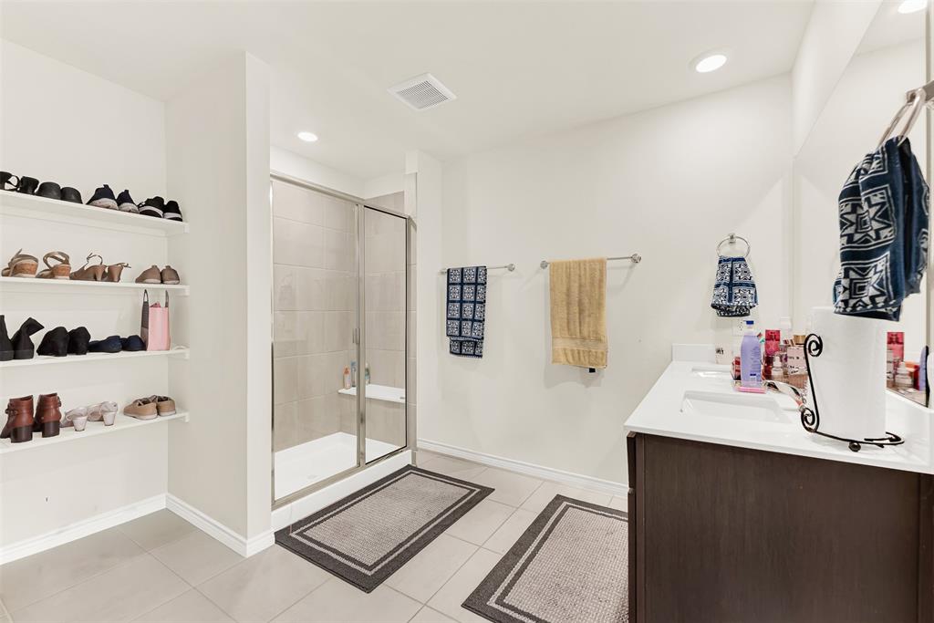 720 Willow View Way Princeton, TX 75407 - Photo 20 of 33 a bathroom with a sink and a shower