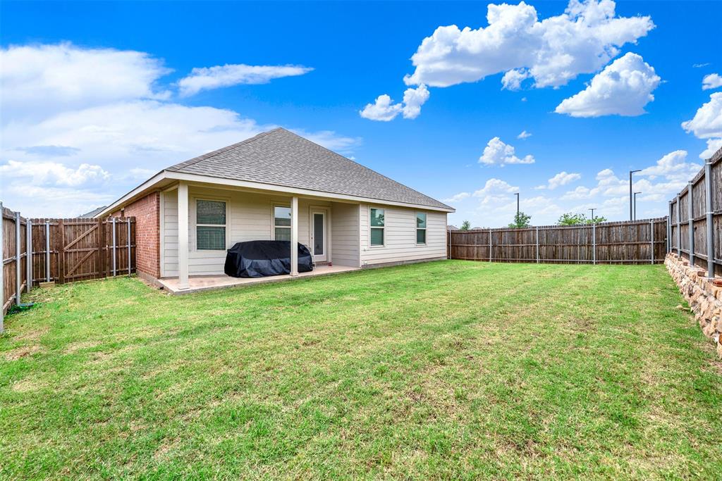 720 Willow View Way Princeton, TX 75407 - Photo 25 of 33 a view of a house with backyard and garden