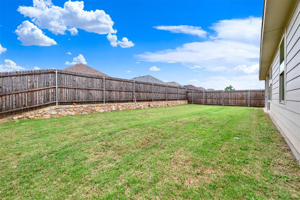 720 Willow View Way Princeton, TX 75407 - Photo 28 of 33 a view of a backyard with a garden
