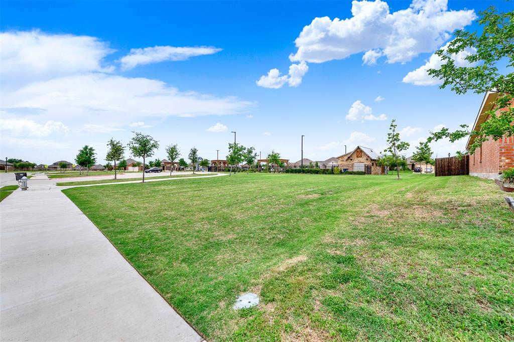 720 Willow View Way Princeton, TX 75407 - Photo 29 of 33 a view of a golf course with a lake