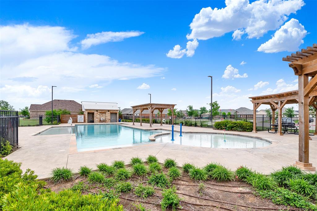 720 Willow View Way Princeton, TX 75407 - Photo 32 of 33 a view of a patio with a table and chairs