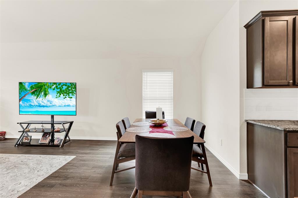 720 Willow View Way Princeton, TX 75407 - Photo 7 of 33 a view of a dining room with furniture and wooden floor