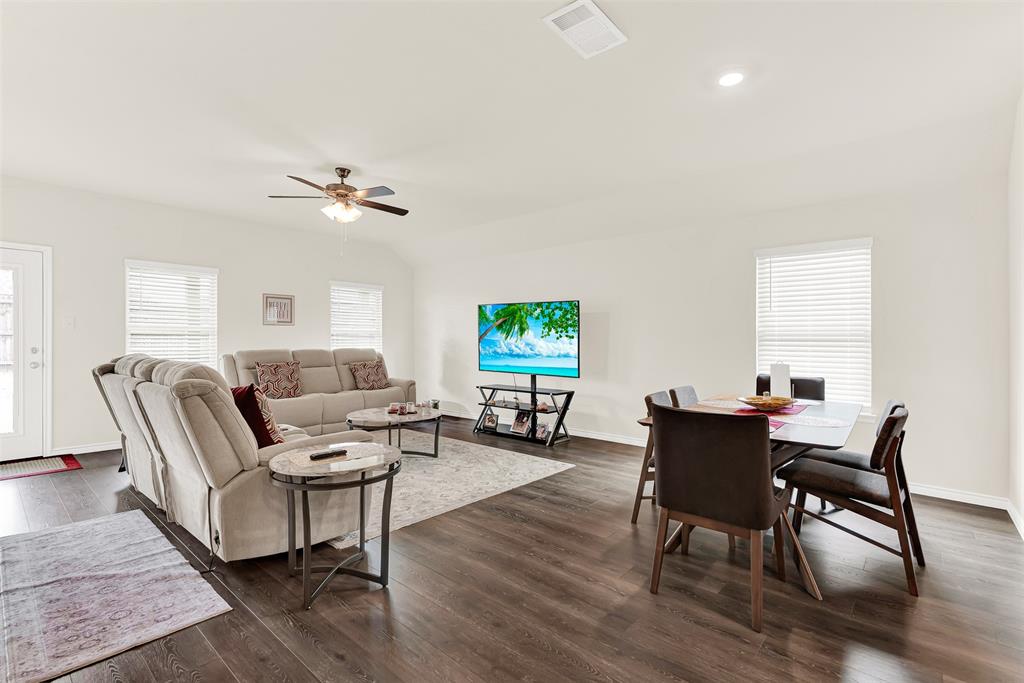 720 Willow View Way Princeton, TX 75407 - Photo 8 of 33 a living room with furniture a window and a flat screen tv
