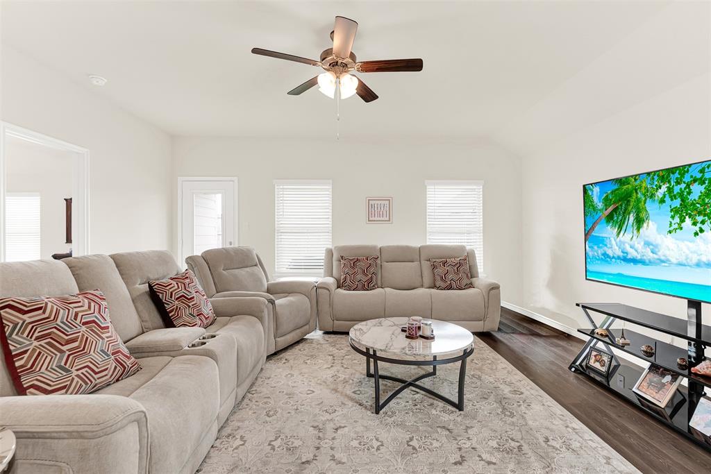 720 Willow View Way Princeton, TX 75407 - Photo 9 of 33 a living room with furniture ceiling fan and a window