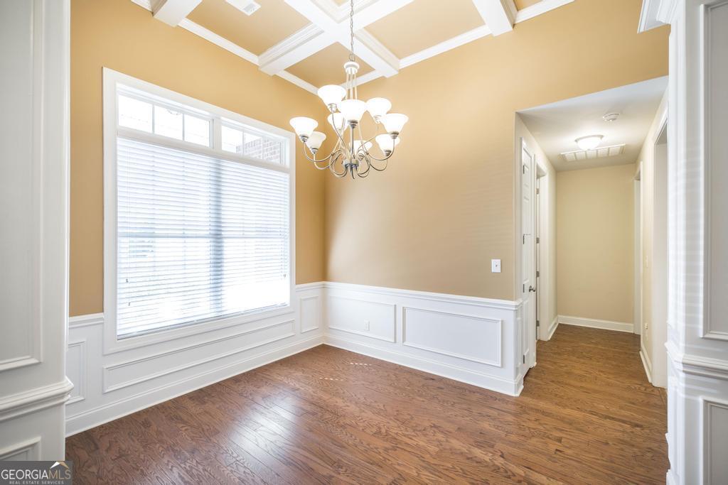 206 Londe Lane Perry, GA 31069 - Photo 8 of 37 an empty room with wooden floor and windows
