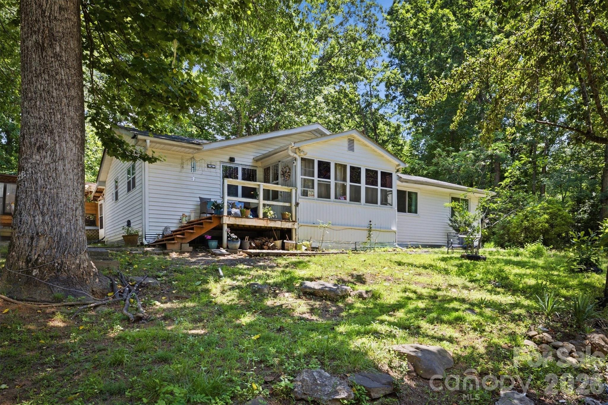 3153 Faith Temple Church Road Morganton, NC 28655 - Photo 1 of 24 a house with trees in the background