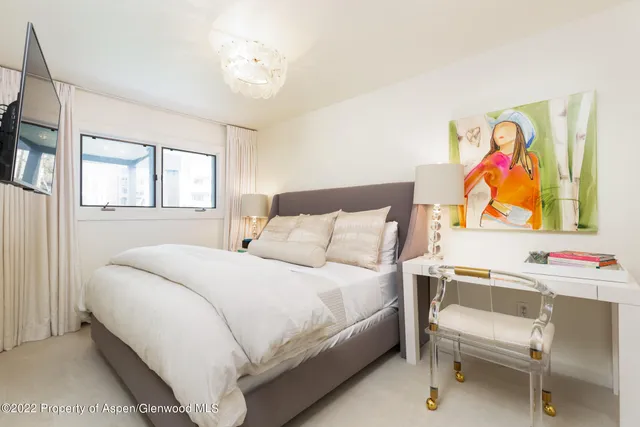 a bedroom with a bed and a cabinets