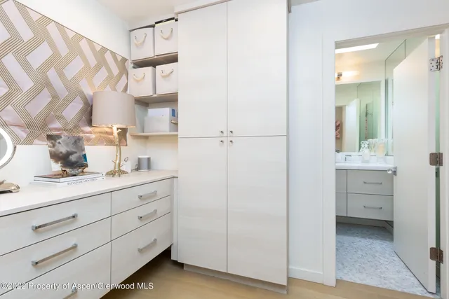 a room with a mirror and a sink