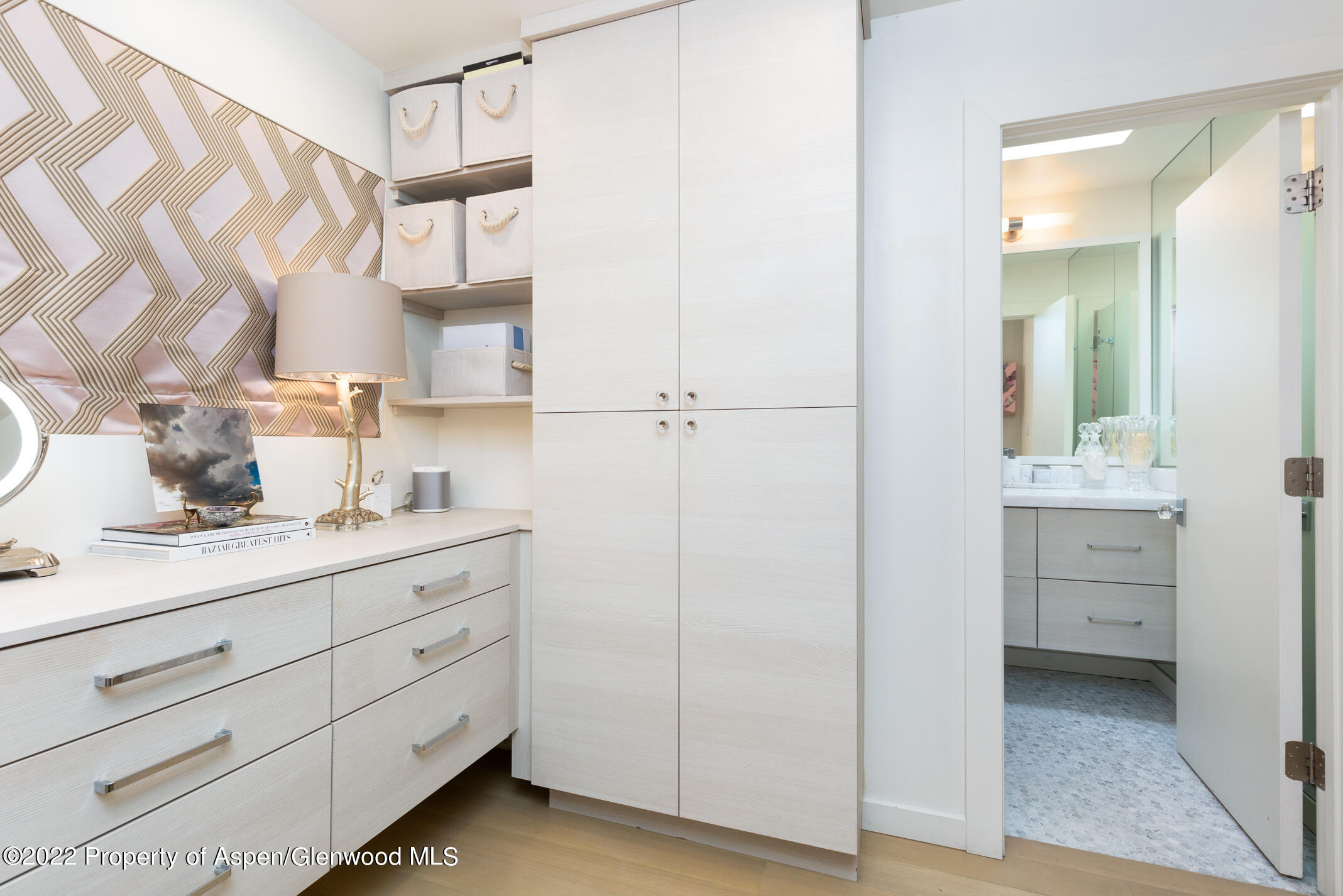 124 East Durant Avenue, Unit 2 Aspen, CO 81611 - Photo 7 of 15 a room with a mirror and a sink