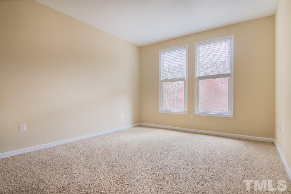 710 North Person Street, Unit 102 Raleigh, NC 27604 - Photo 11 of 13 The possibilities are endless for this den area that is as big as a bedroom!