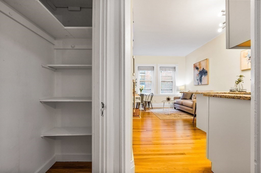 481 Beacon Street, Unit 43 Boston, MA 02115 - Photo 4 of 10 a living room with furniture and a table