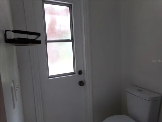 a bathroom with a toilet