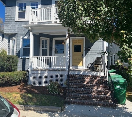 a view of a house with wooden fence