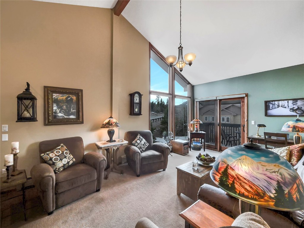 a living room with furniture ceiling fan and a rug