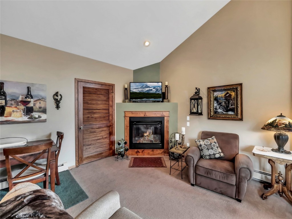 3710 Ryan Gulch Road, Unit 3710 Silverthorne, CO 80498 - Photo 11 of 50 a living room with furniture and a fireplace