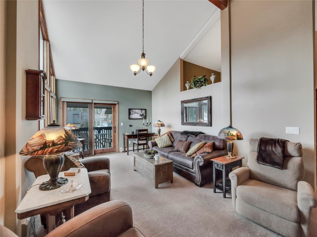 3710 Ryan Gulch Road, Unit 3710 Silverthorne, CO 80498 - Photo 2 of 50 a living room with furniture ceiling fan and a window